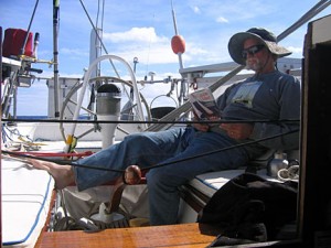The tiller is tied while the captain researches the problem in the calm of day