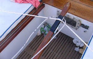 the wind vane steering lines are attached to the tiller with a vise clamp and hose clamps